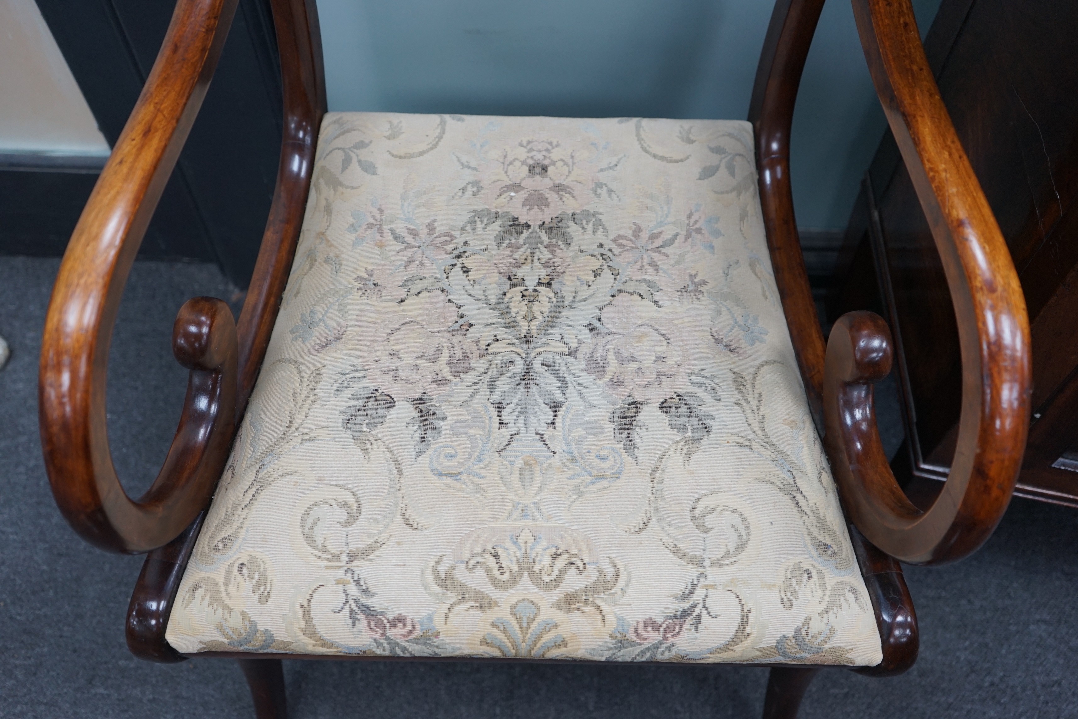 A harlequin set of eight Regency and later mahogany dining chairs on sabre legs, two with arms